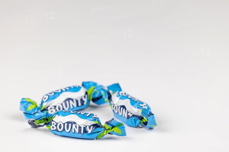 Three Bounty, small chocolate bars on a white background