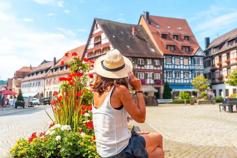 A female tourist in the old town of Gengenbach in the Black Forest, Germany