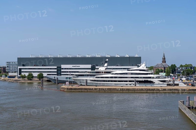 Oceanco shipyard in Alblasserdam, specialising in the construction of mega yachts, luxury yachts, on the river Noord, South Holland, in front the H3 yacht, 105 metres long, completely renovated, rebuilt, behind the superyacht Seven Seas Yacht, 109 metres long, owned by Steven Spielberg, Netherlands
