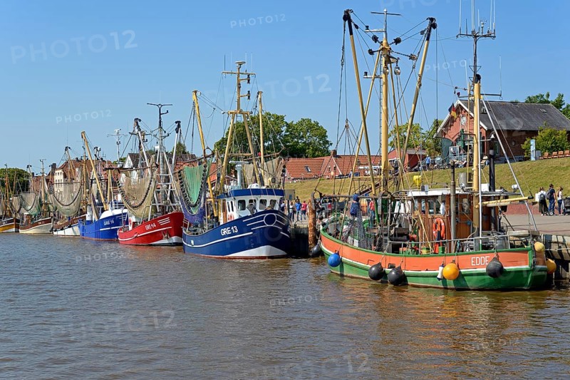 Crab cutter in the harbour of Greetsiel, blue sky, North Sea, Lower Saxony, Germany