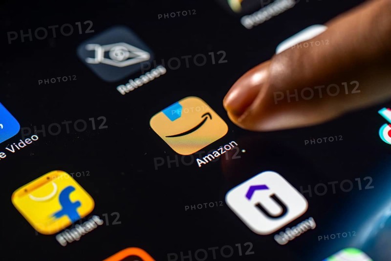 In this photo Illustration a person taps Amazon shopping app icon on a tablet device on 24 May 2025 in New Delhi, India