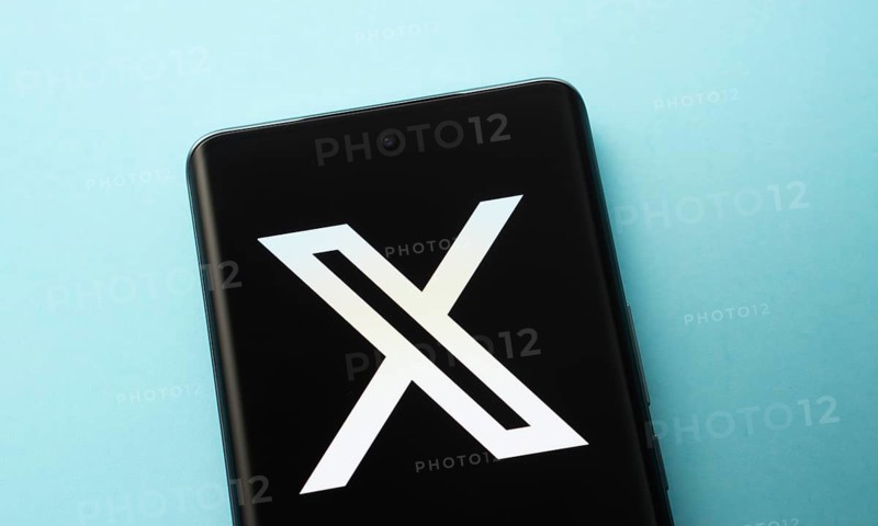X (twitter) logo is seen on a smartphone