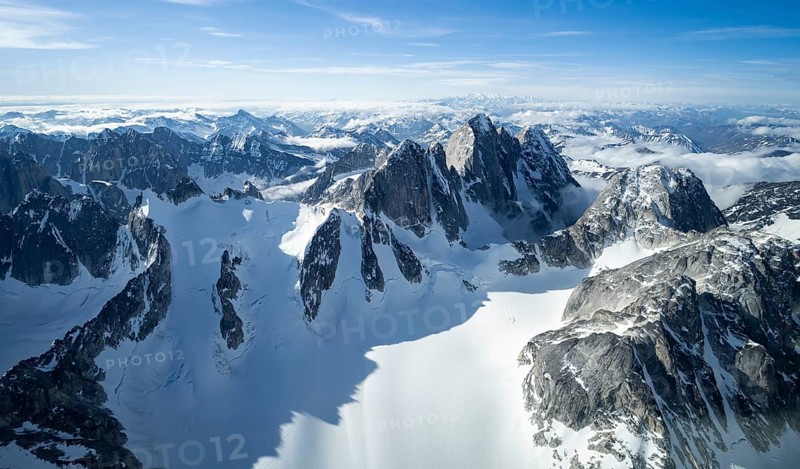 Rock cliffs, snow and ice, epic mountains with glaciers, aerial view, Alaska Range, Denali National Park, Alaska, USA