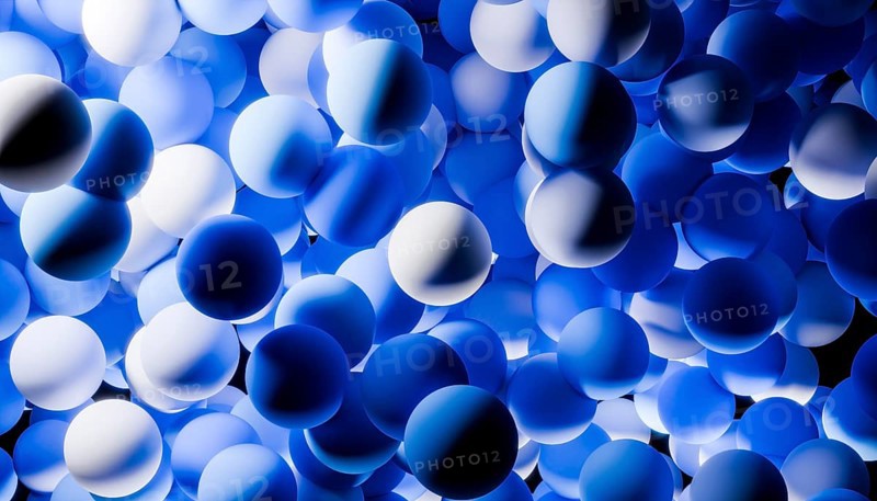 A mesmerizing illustration of 3D blue spheres clustered together, creating a dynamic and abstract visual pattern. The varying shades add depth and intrigue to the composition