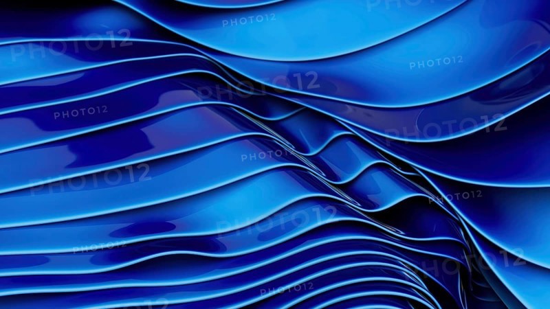 This image captures smooth blue silk waves creating a modern and elegant abstract design. The fluidity and curves convey movement and sophistication, perfect for artistic projects