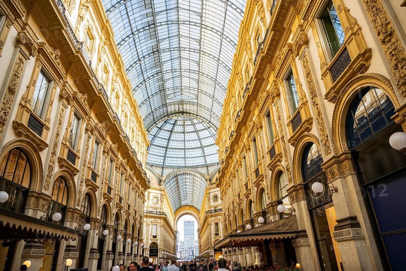 View of the Galleria Vittorio Emanuele with its many luxury shops in Milan on a sunny day, Milan, Italy