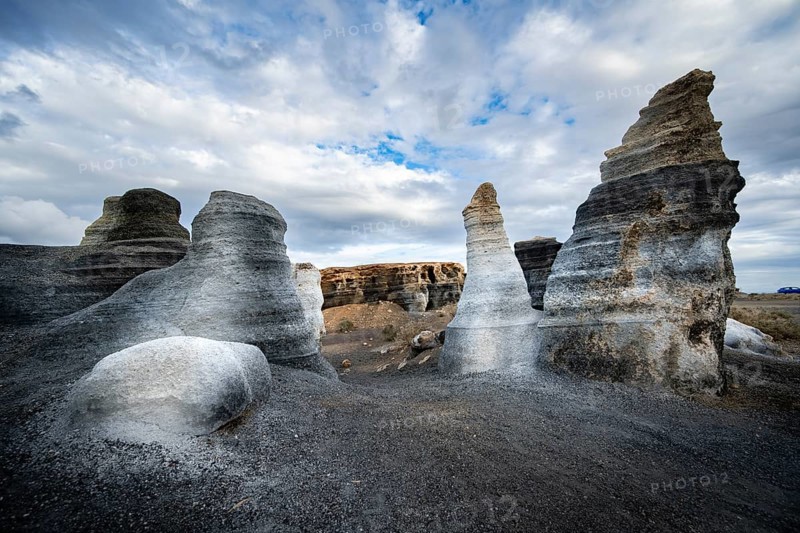 Eroded rock formations, volcanic landscape with dramatic cloudy skies, Ciudad Estratificada or Los Roferos, Antigua Rofera de Teseguite, Lanzarote, Canary Islands, Spain