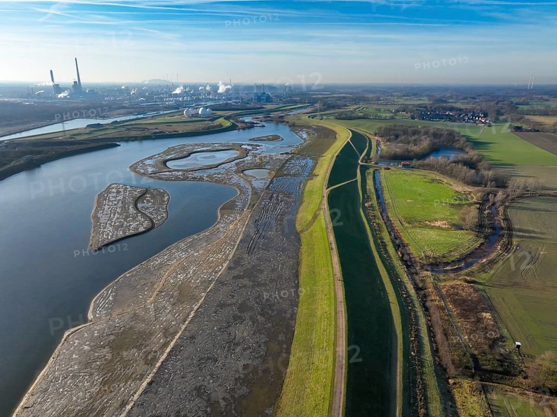 Haltern-Marl, North Rhine-Westphalia, Germany - Lippe, flood protection in the Haltern-Lippramsdorf-Marl area (HaLiMa) . Flood protection on the River Lippe by relocating the dyke and thus extending the floodplain. On the right, the completed floodplain north, the north dyke. Work is still underway on the south dyke. Marl Chemical Park in the back