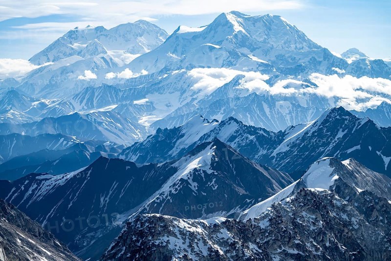 Clouds over high mountains, Mt Foraker and Mt Denali or Mount McKinley, aerial view, Alaska Range, Denali National Park, Alaska, USA