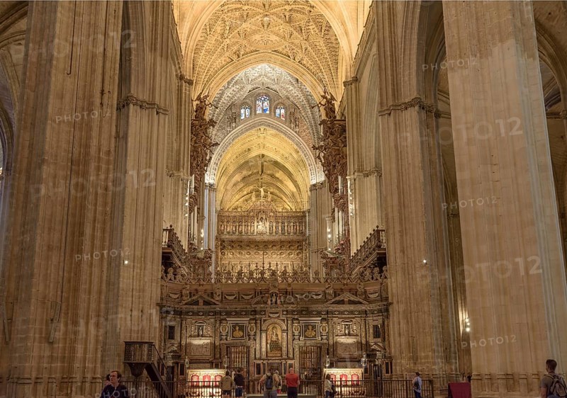 Impressive organ and architecture with ornate vaults in a church, Seville, Andalusia, Spain