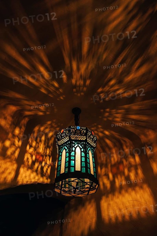 From below colorful lamp with glowing lights in dark room