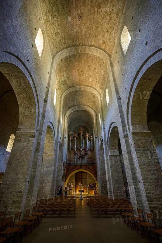 View of the entrance and the organ in the abbey of Gellone, also Saint-Guilhem-le-Désert monastery, Département Hérault, France