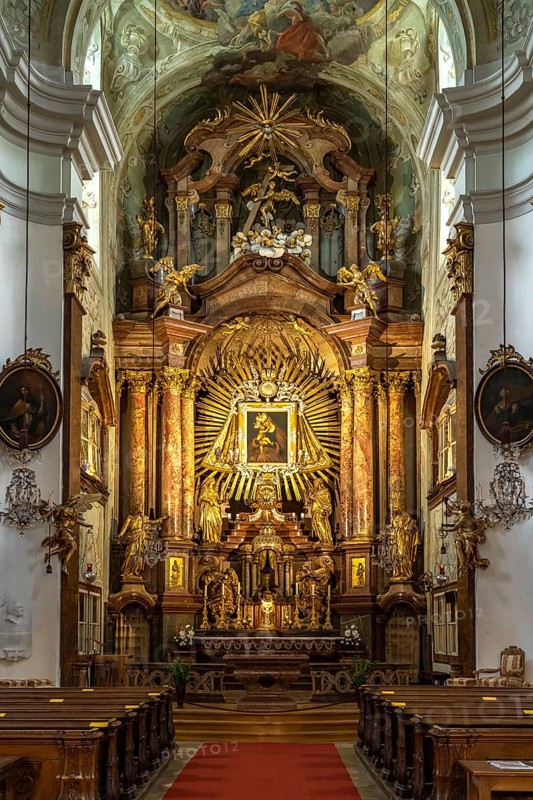 Altar of the baroque parish church Mariahilfer Kirche in Vienna, Austria