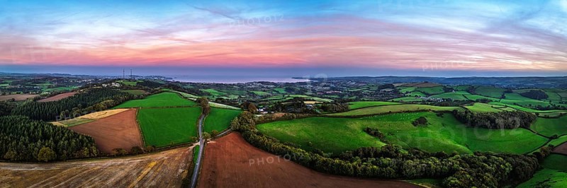 Sunset of Devon Farms and Fields over Berry Pomeroy from a drone, Totnes, England, United Kingdom
