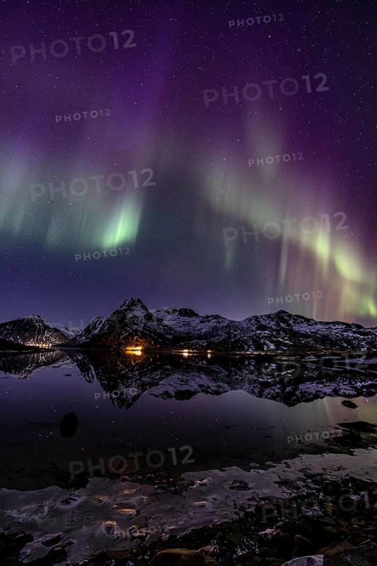 Northern lights over fjord, steep mountains, winter, aurora borealis, Flakstadoya, Lofoten, Norway