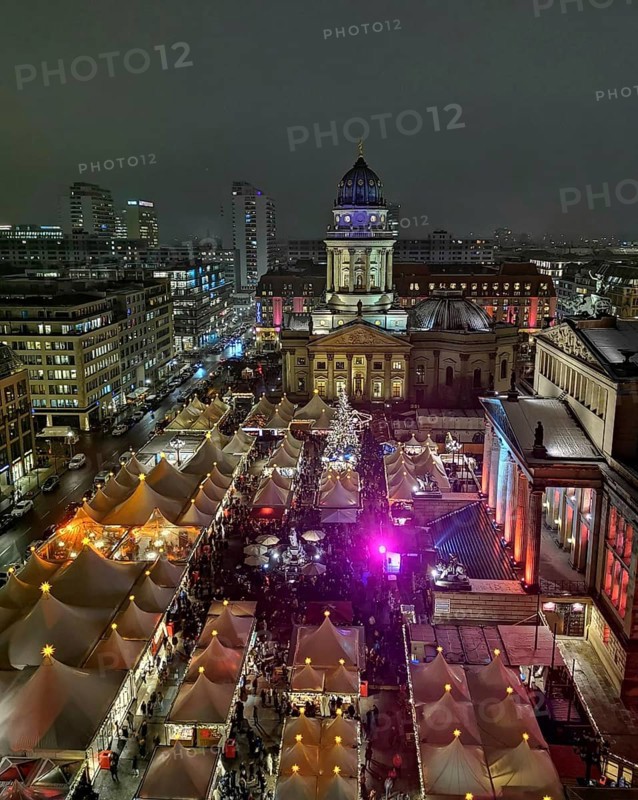 View from above of lively Christmas market atmosphere at night on the Gendarmenmarkt, Berlin
