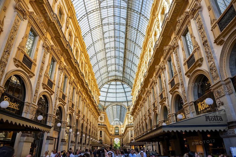 View of the Galleria Vittorio Emanuele with its many luxury shops in Milan on a sunny day, Milan, Italy