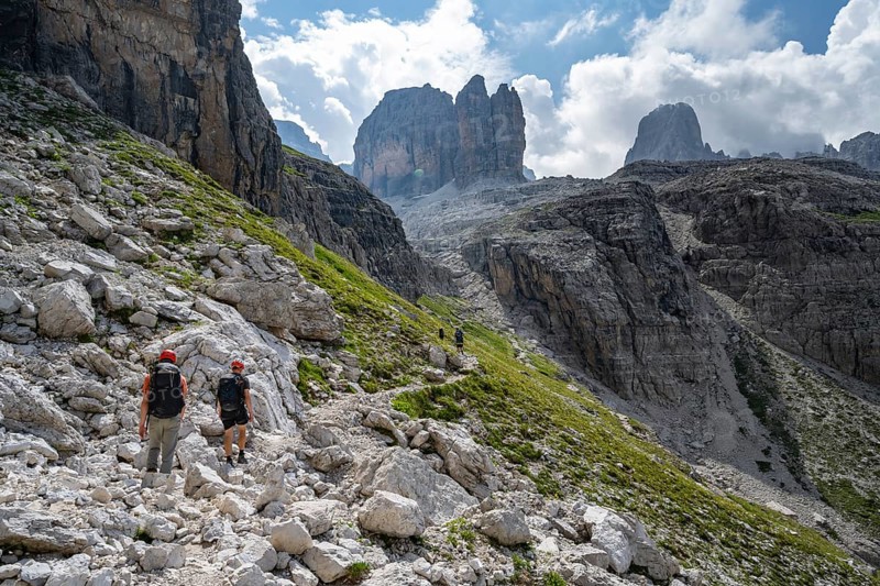 Two mountaineers in front of picturesque mountain landscape with rocky peaks, Via Ferrata SOSAT via ferrata, Brenta Mountains, Trentino, Italy