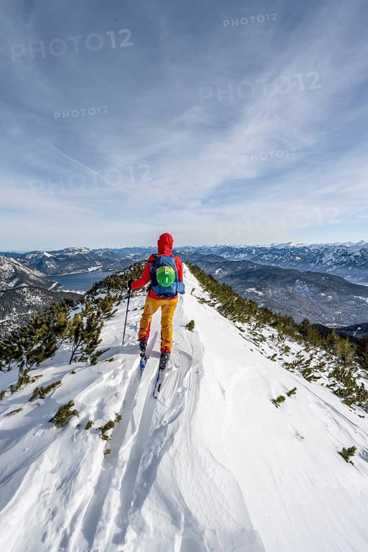 Ski tourer at the summit of Simetsberg, mountain panorama, Estergebirge, Bavarian Prealps, Bavaria Germany