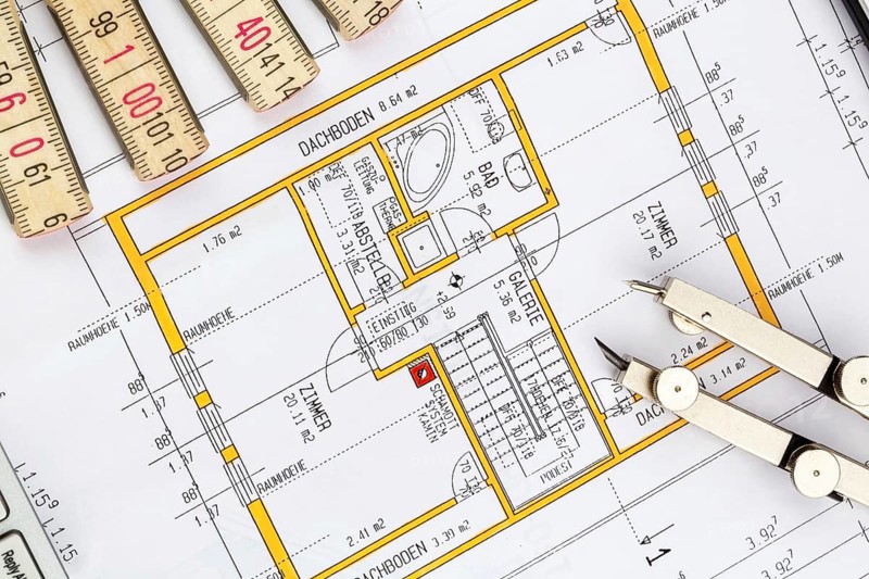 An architect's plan for the construction of a new home. Symbolic photo for financing and planning a new house, single-family house studio shot