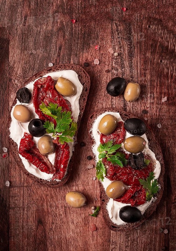 Breakfast, sandwiches, with cream cheese, olives, top view
