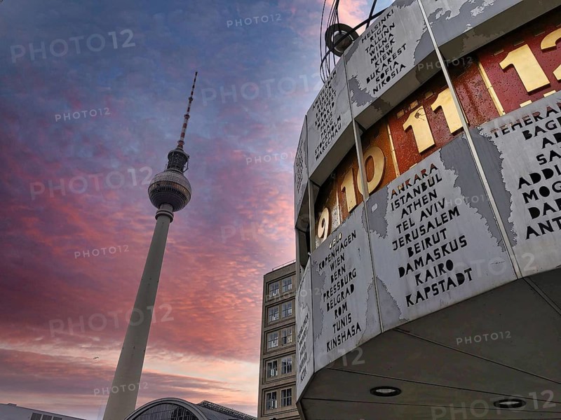 Atmospheric sunset with pink sky over Berlin World Clock and Berlin TV Tower, Alexanderplatz, Alex, Mitte, Berlin