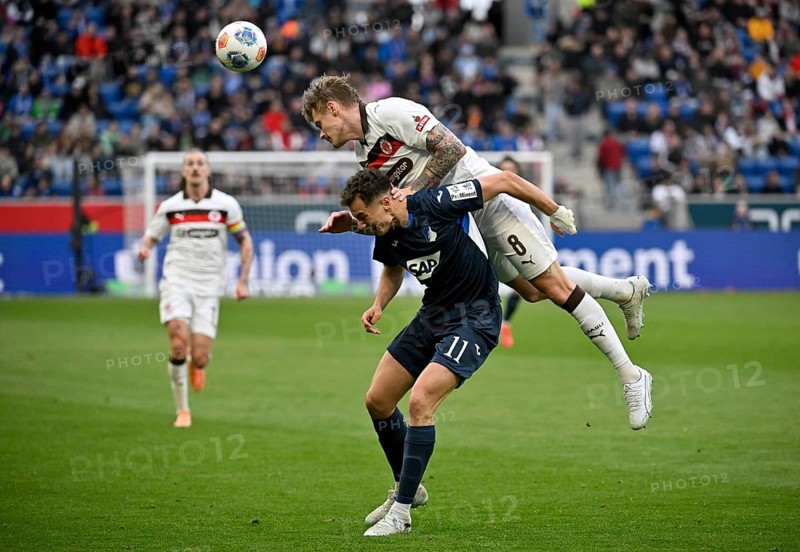 Duel, action Fisnik Asllani TSG 1899 Hoffenheim (11) against Eric Smith FC St. Pauli (08) Soccer Bundesliga, PreZero Arena, Sinsheim, Baden-Württemberg, Germany