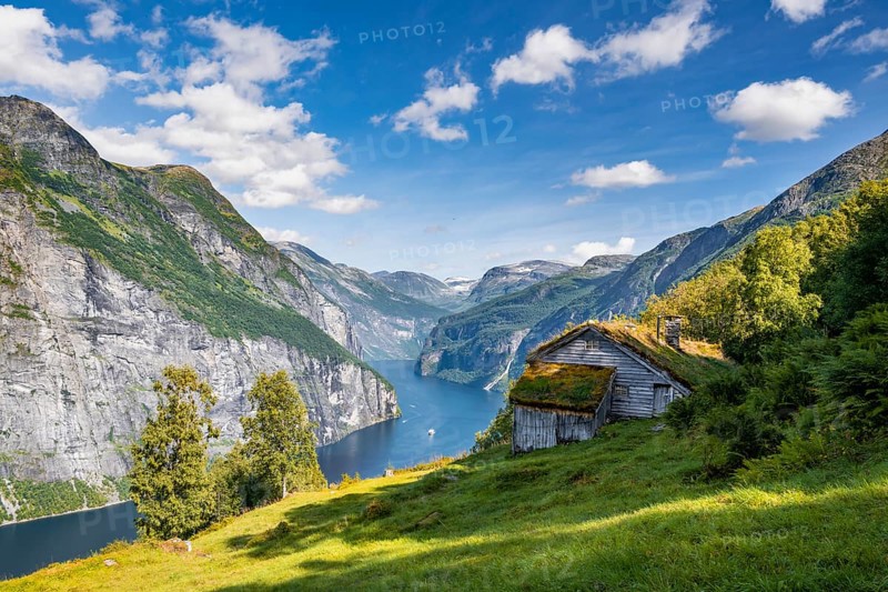 Blomberg Gård, historic mountain farm on steep mountainside, Geirangerfjord, near Geiranger, Møre og Romsdal, Norway