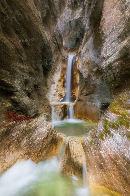 Waterfall with zoom effect Heckenbach waterfall, The dripping eye of nature, Kochel am See, Bavaria, Germany