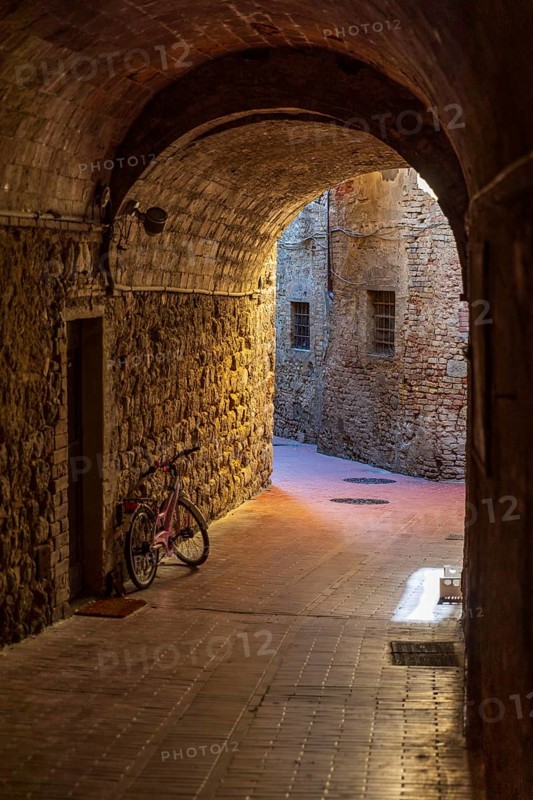 Tunnel in an alley in San Gimignano, Tuscany, Province of Siena, Italy