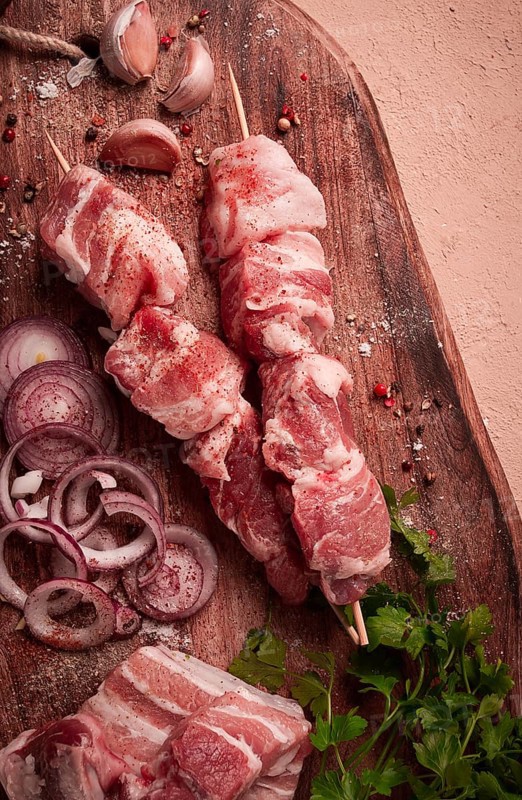 Raw pork meat, on wooden sticks, pickled kebab, with spices, top view, no people