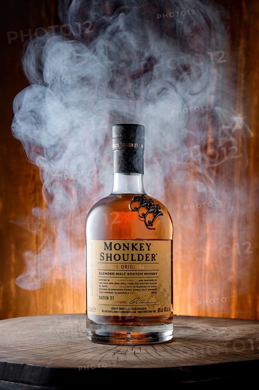 April 8, 2022, Minsk, Belarus, bottle of Monkey Shoulder blended malt scotch whisky surrounded with smoke