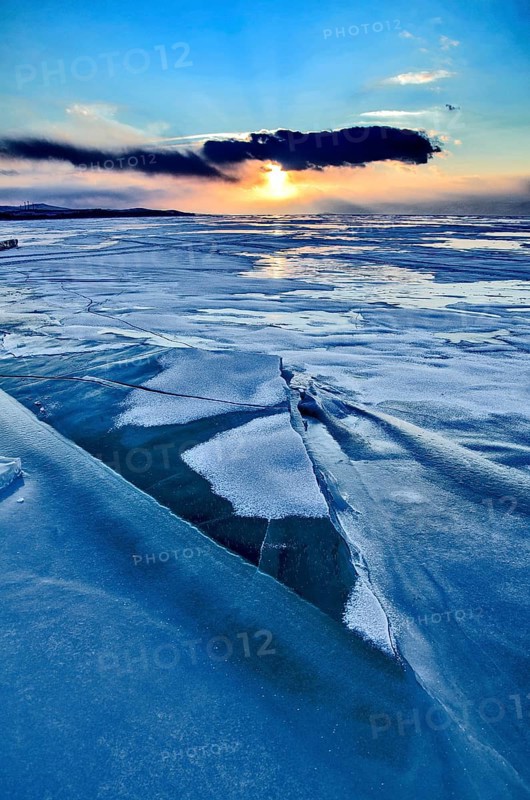 Sunset on ice, Lake Baikal, Olkhon Island, Pribaikalsky National Park, Irkutsk Province, Siberia, Russia