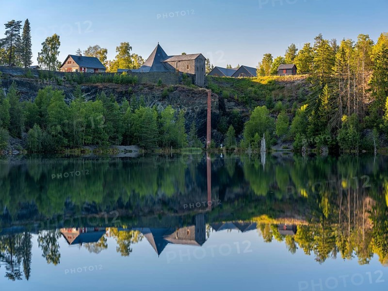 The slate lake in the Kießlichbruch in the evening light, former slate quarry, Technical Monument Historic Slate Mining Lehesten, Thuringia, Germany