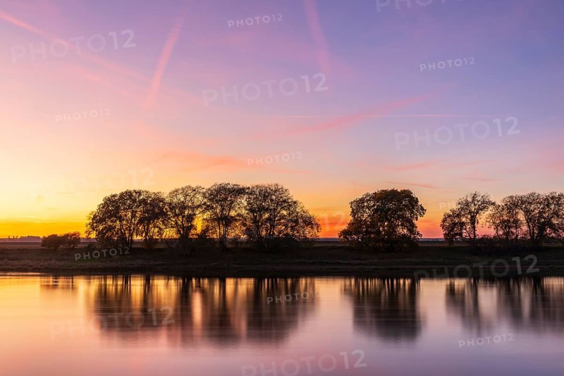 Colourful evening sky after sunset on the Elbe in Kreinitz, Saxony, Germany