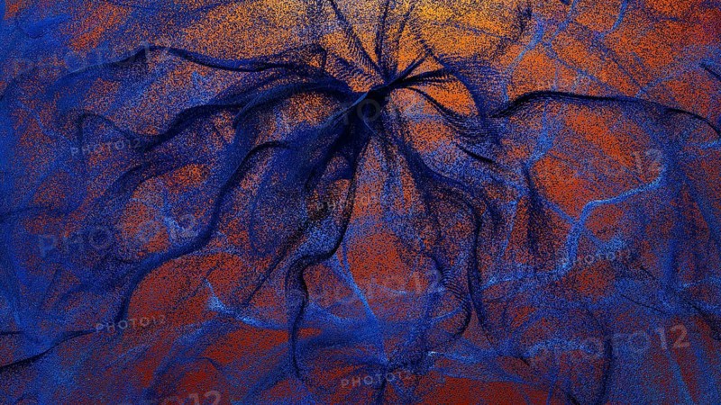 An intricate design featuring swirling particles in shades of blue and orange This abstract background evokes a sense of depth and movement, perfect for various digital applications