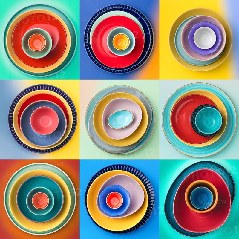 A vibrant collection of nine stacked plates arranged in a grid pattern. Each set features a unique mix of colors and sizes, creating a lively and artistic display