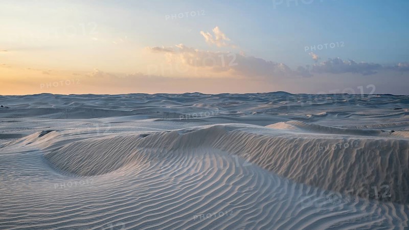 Sunset, white sand dunes in the Khaluf desert, Oman