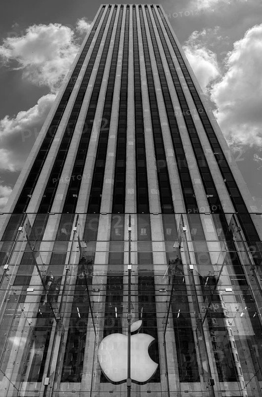 Apple logo in front of a skyscraper in Central Park, New York City, USA