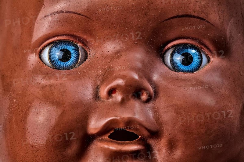 Old doll, demonic face