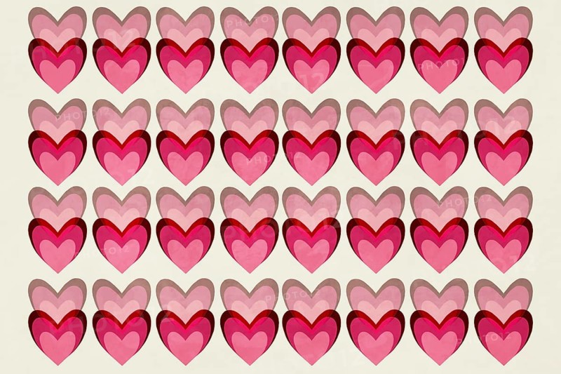 A seamless pattern of overlapping hearts in vibrant shades of pink and red, creating a playful and romantic aesthetic against a light background