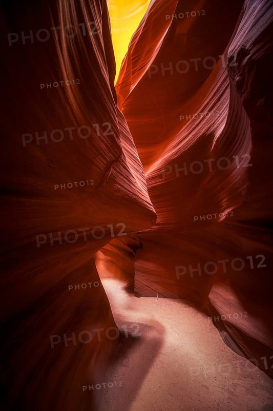 Explore the enchanting curves and colors of Antelope Canyon in the USA. This narrow slot canyon showcases flowing sandstone formations, illuminated by soft, natural light