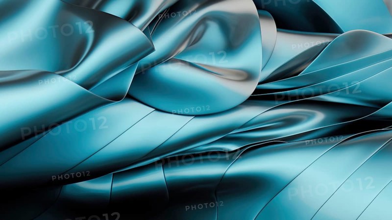 A digitally rendered image captures smooth, flowing waves of metallic blue fabric. The abstract design mimics the softness of silk, offering a sense of luxury and fluidity