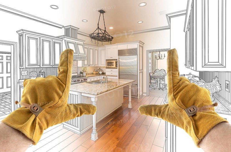 Male Contractor Hands Framing Completed Section of Custom Kitchen Design Drawing