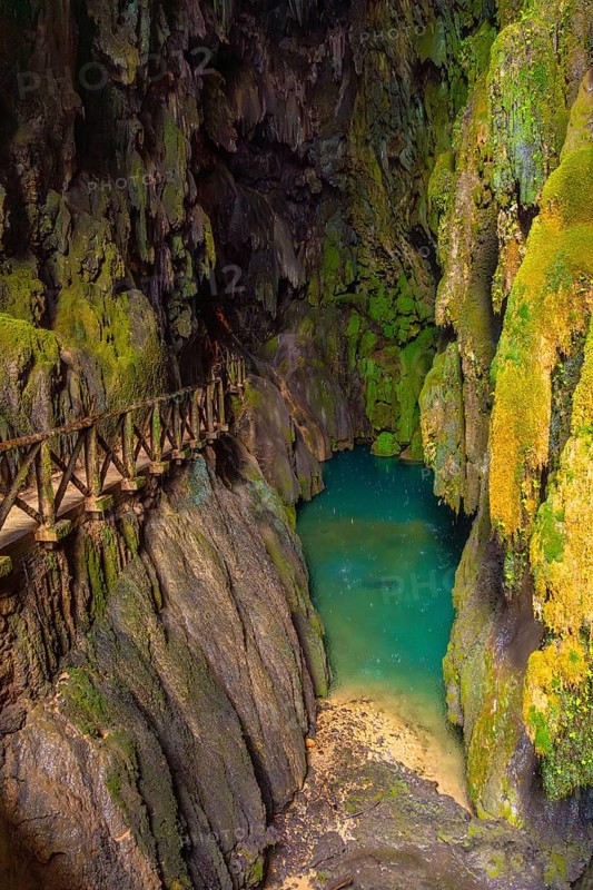 Beautiful colours inside the Iris Grotto at the Cola de Caballo Waterfall in the Monasterio de Piedra Natural Park, Aragon