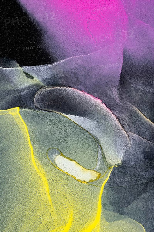 This abstract art features a vibrant mix of neon colors, pink, green, and yellow swirling dynamically across a black paper background. The colors glow intensely against the dark, creating an eye-catching visual effect