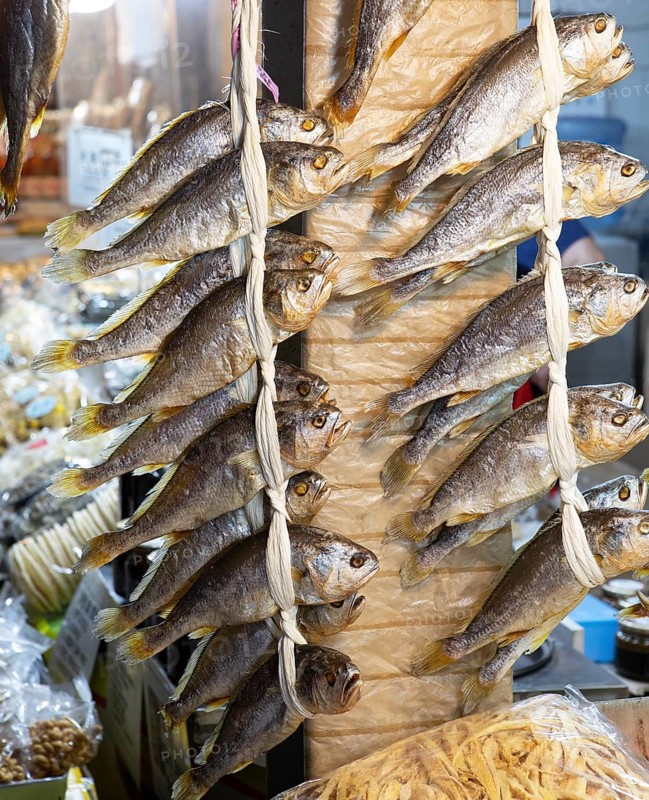 Dried fish on a conveyor belt, Gwangjang market, traditional street market in Jongno-gu, Seoul, South Korea