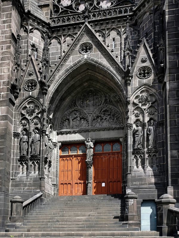 Clermont-Ferrand. The porch of the cathedral Notre-Dame-de-lAssomption. Puy de Dome department. Auvergne Rhone Alpes. France