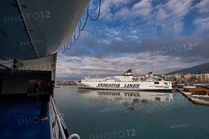 View from a ferry of the harbor with ships and dramatic clouds, Old ferry port in central Patras, Ferries, Patras, Peloponnese, Greece