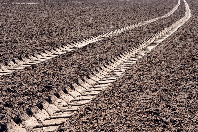 Tractor tracks, agricultural trails at a cultivated field in springtime, farmland near Wesertal, Weser Uplands, Weserbergland, Hesse, Germany